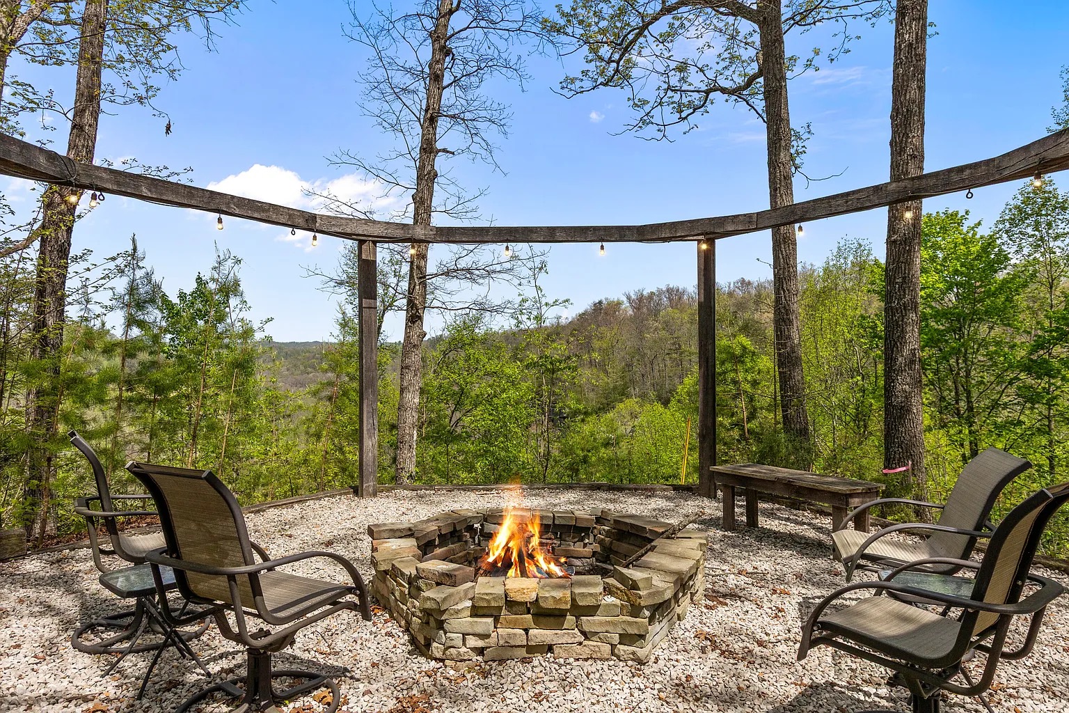 Back screened porch with outdoor movie projector at Canyon Ridge Retreats