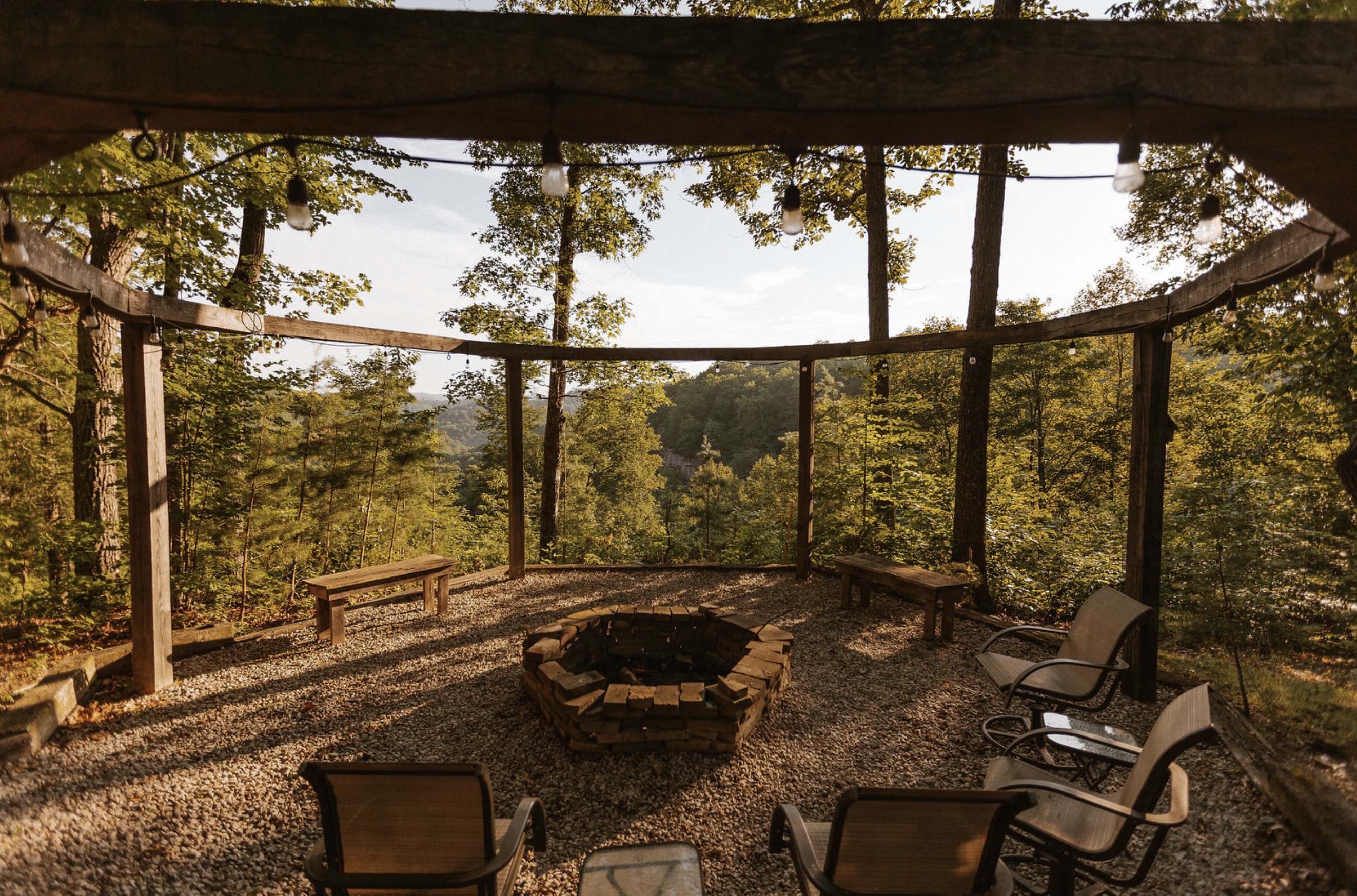 Canyon Ridge Retreats fire pit with canyon valley view and string lights
