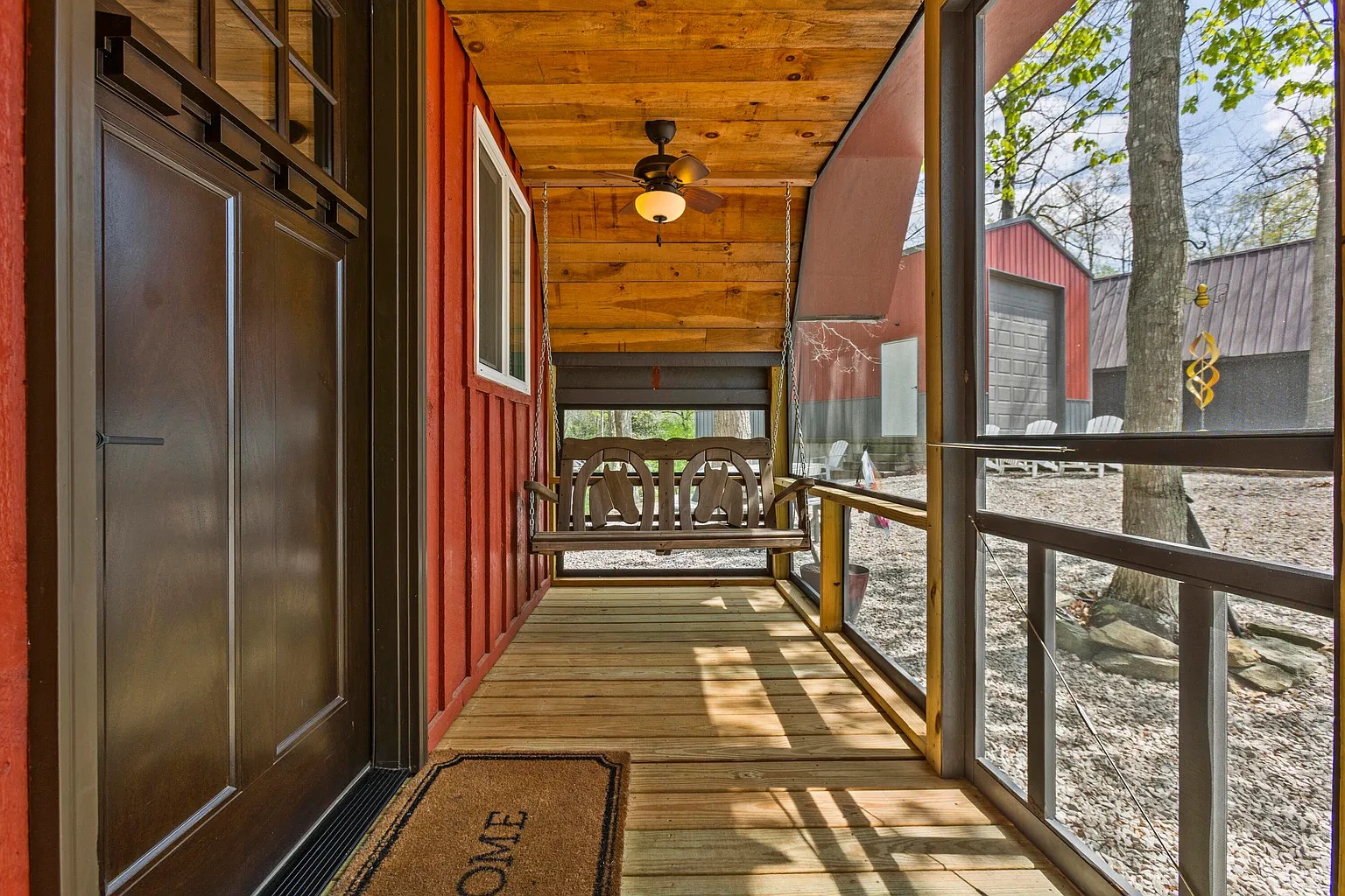 Screened front porch with porch swing at Canyon Ridge Retreats cabin
