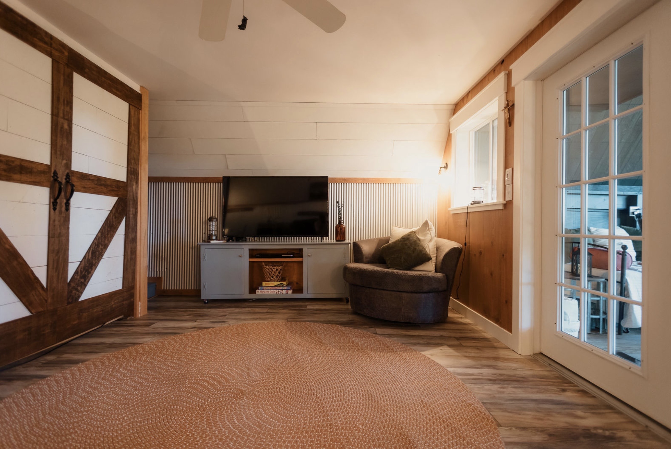 Canyon Ridge Retreats living room with smart TV barn door and cozy seating